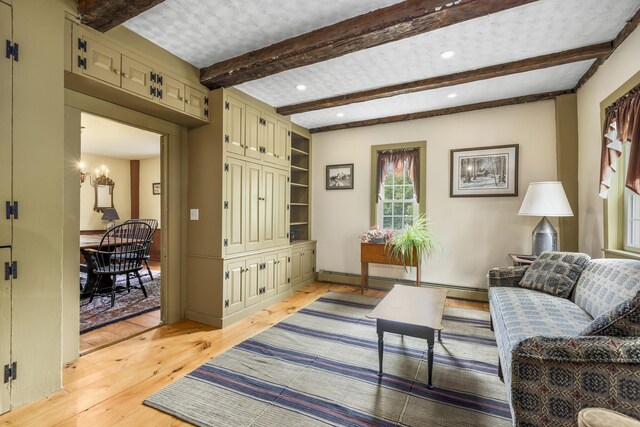 598 Walnut Hill Rd, North Yarmouth, ME 04097 - living area with light wood-type flooring, beamed ceiling, a chandelier, a baseboard radiator, and recessed lighting