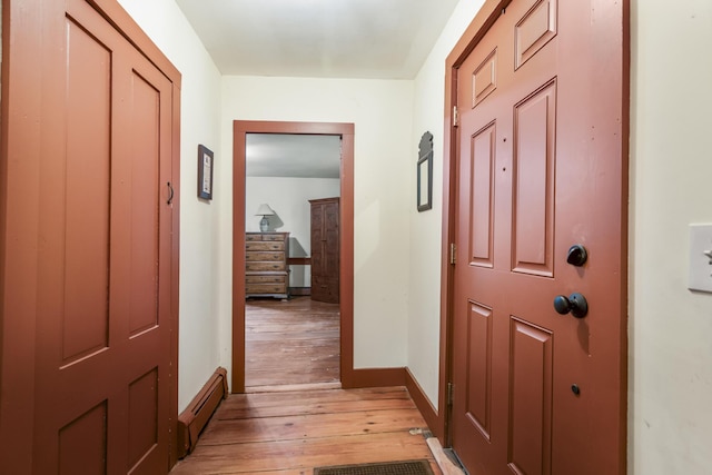 598 Walnut Hill Rd, North Yarmouth, ME 04097 - foyer featuring light wood-type flooring, baseboards, and baseboard heating