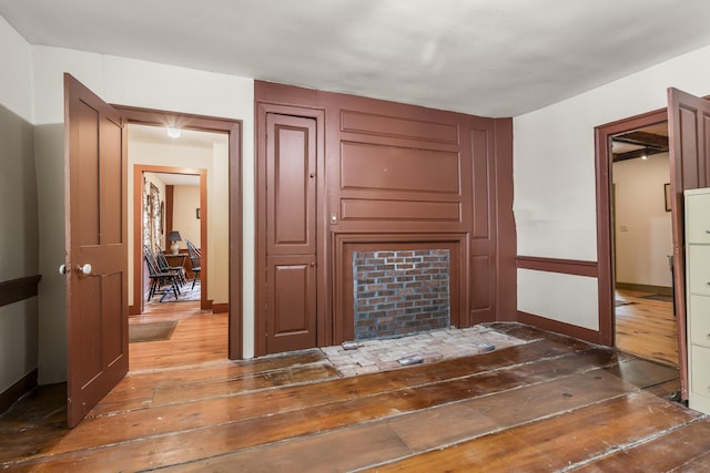 598 Walnut Hill Rd, North Yarmouth, ME 04097 - unfurnished living room with hardwood / wood-style floors and baseboards