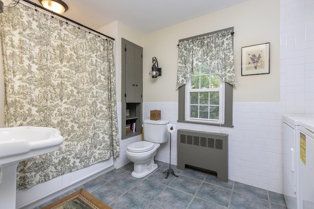 598 Walnut Hill Rd, North Yarmouth, ME 04097 - full bath featuring radiator heating unit, separate washer and dryer, tile walls, tile patterned floors, and a wainscoted wall