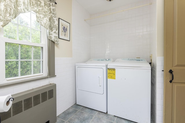 598 Walnut Hill Rd, North Yarmouth, ME 04097 - laundry room featuring radiator heating unit, tile walls, independent washer and dryer, and light tile patterned flooring