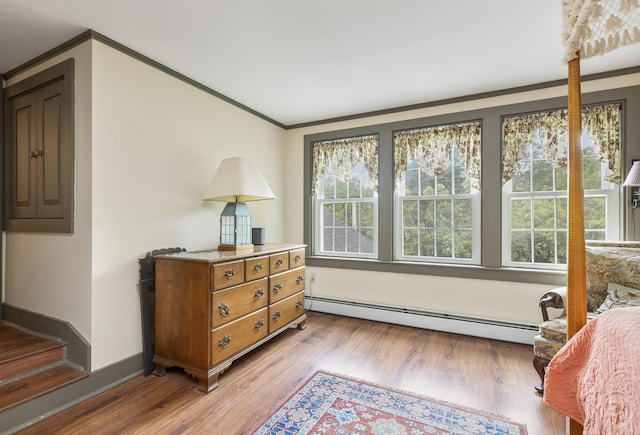 598 Walnut Hill Rd, North Yarmouth, ME 04097 - sitting room with baseboard heating, plenty of natural light, crown molding, wood finished floors, and baseboards