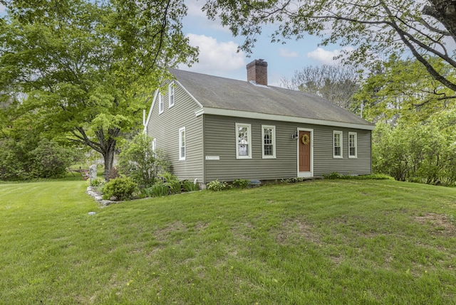 598 Walnut Hill Rd, North Yarmouth, ME 04097 - view of front of property with a chimney and a front lawn