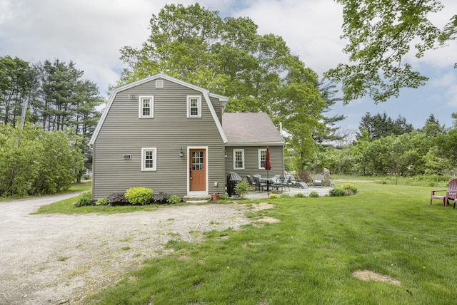 598 Walnut Hill Rd, North Yarmouth, ME 04097 - rear view of property with a yard, a gambrel roof, entry steps, a patio, and view of scattered trees