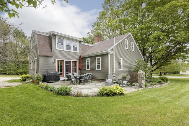 598 Walnut Hill Rd, North Yarmouth, ME 04097 - back of house with a yard, a patio area, roof with shingles, and a chimney