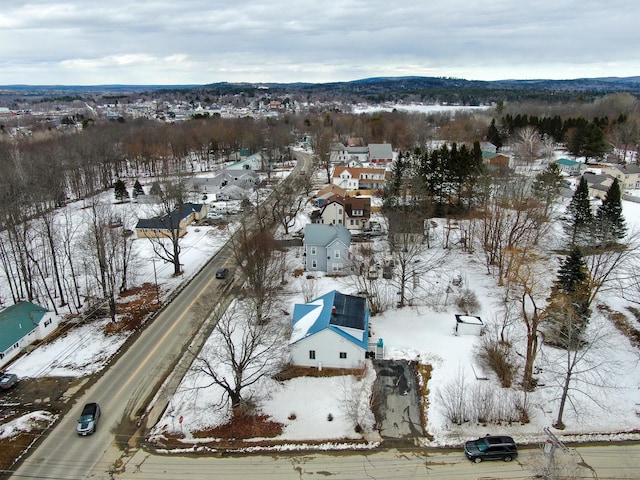 snowy aerial view with a residential view