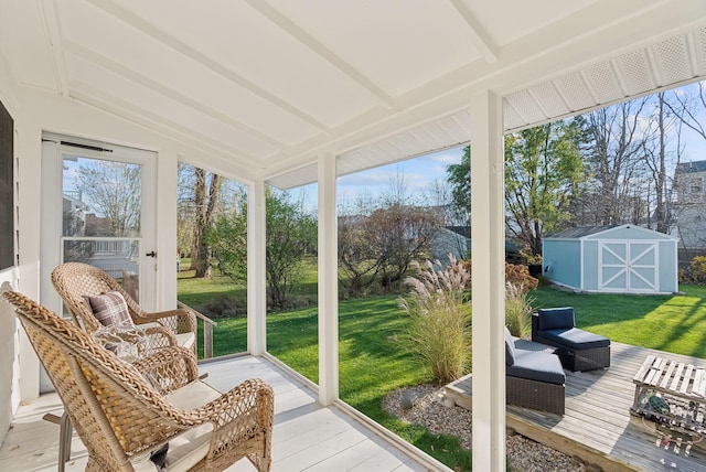 sunroom featuring beam ceiling