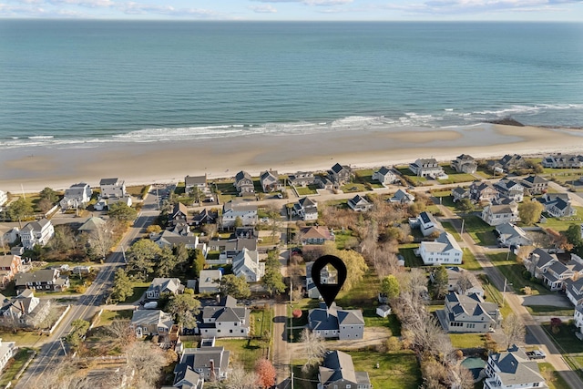 birds eye view of property with a residential view, a view of the beach, and a water view