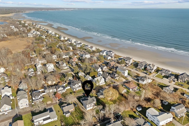 drone / aerial view featuring a beach view and a residential view