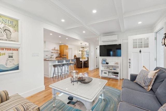 living area with beamed ceiling, recessed lighting, coffered ceiling, and light wood finished floors