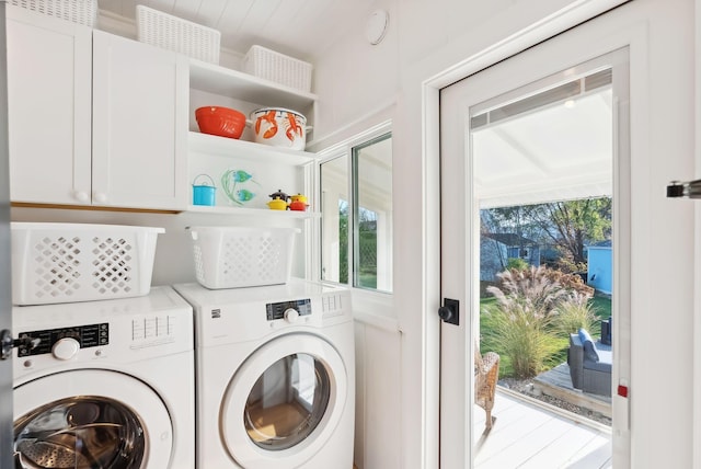 laundry area featuring washer and dryer and cabinet space