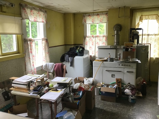 misc room featuring washer / clothes dryer and water heater