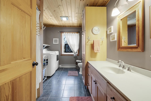 bathroom with wooden ceiling, vanity, tile patterned floors, toilet, and separate washer and dryer