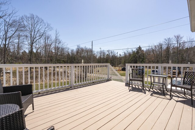 deck featuring a forest view