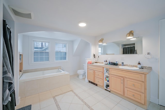 bathroom featuring a sink, visible vents, toilet, and tile patterned floors