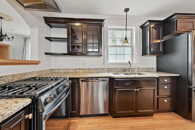 kitchen with open shelves, appliances with stainless steel finishes, dark brown cabinetry, and a sink