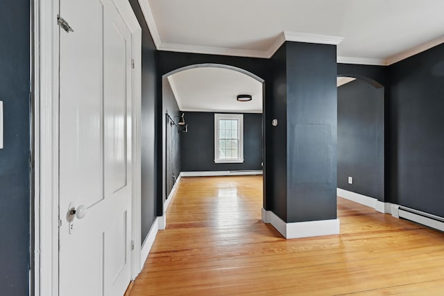 corridor featuring arched walkways, ornamental molding, and light wood-style flooring