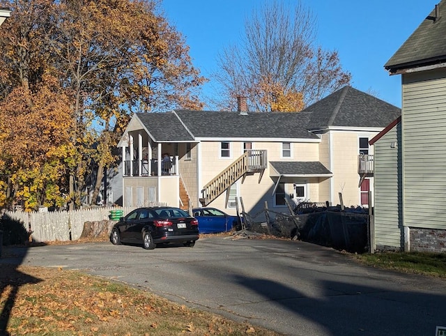 exterior space with roof with shingles