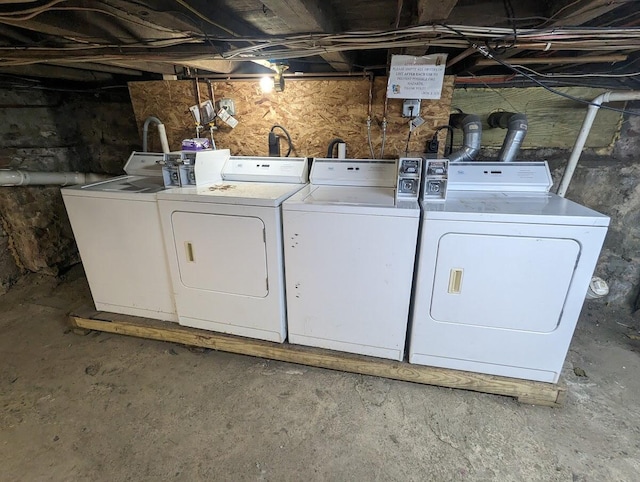 clothes washing area featuring independent washer and dryer and laundry area