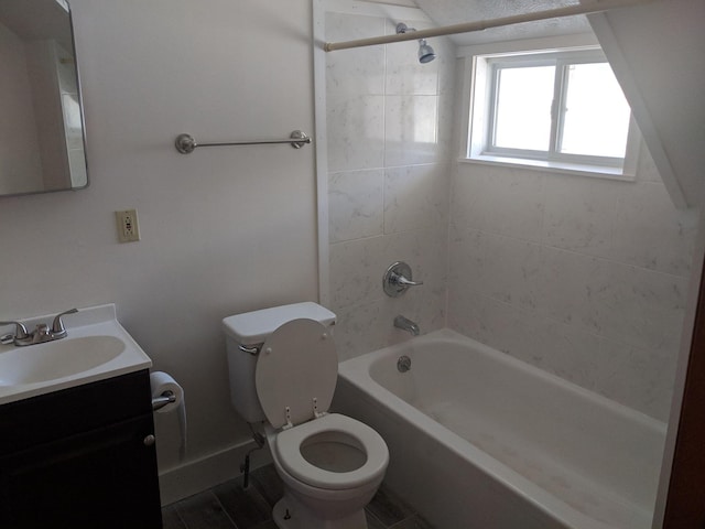 bathroom with bathtub / shower combination, toilet, and vanity