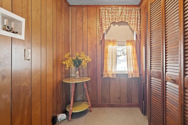 hallway with wood walls