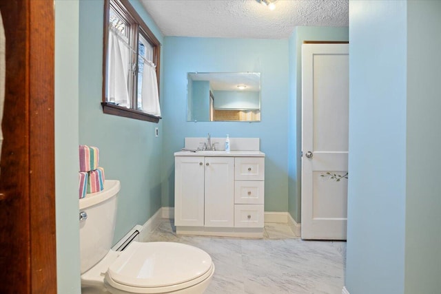 bathroom with marble finish floor, a textured ceiling, toilet, and baseboards