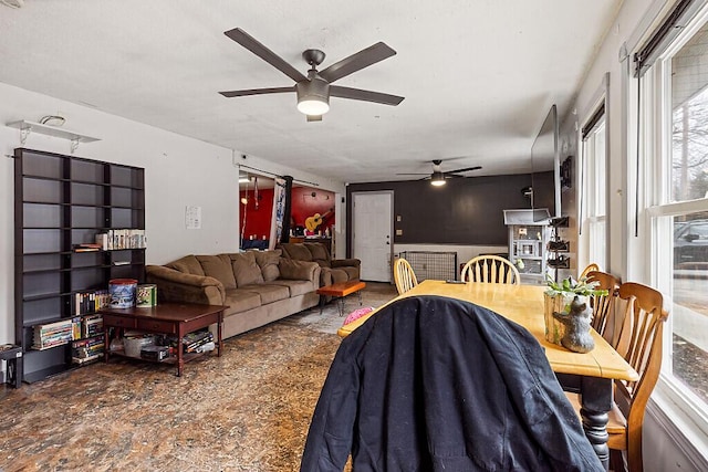 living area featuring a ceiling fan