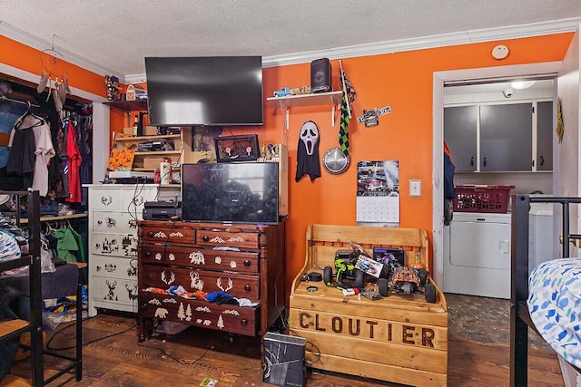 bedroom with crown molding, wood finished floors, separate washer and dryer, and a textured ceiling