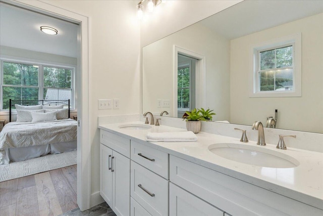 75 Main St, York, ME 03909 - ensuite bathroom with double vanity, plenty of natural light, and wood finished floors