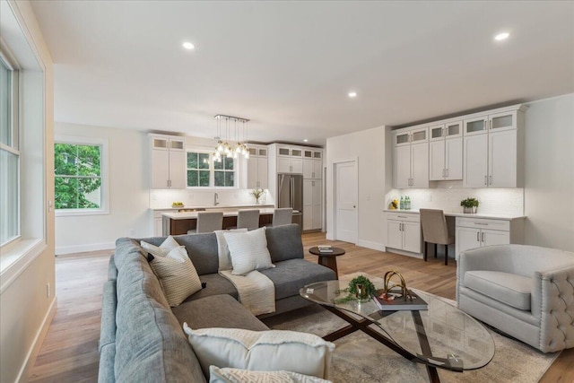 75 Main St, York, ME 03909 - living area featuring light wood-type flooring, recessed lighting, and a chandelier