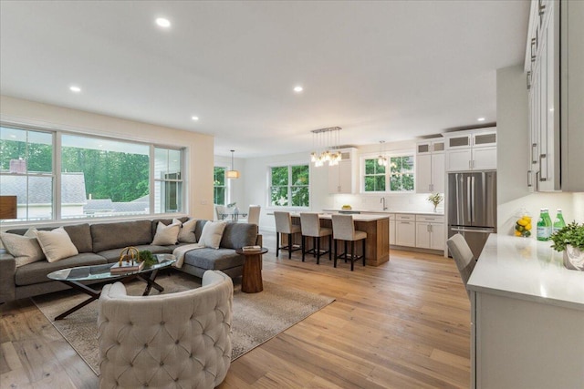 75 Main St, York, ME 03909 - living area featuring light wood finished floors, recessed lighting, and a chandelier