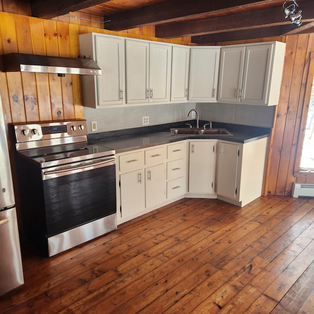 kitchen featuring a sink, dark countertops, under cabinet range hood, and stainless steel range with electric cooktop