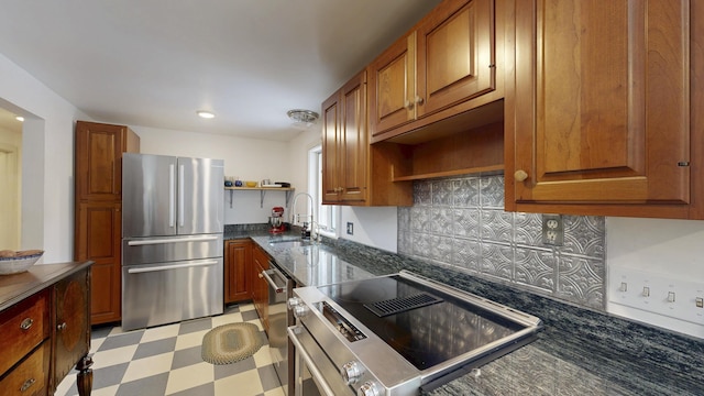 kitchen with brown cabinetry, light floors, open shelves, freestanding refrigerator, and stove