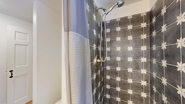 bathroom with a shower with shower curtain