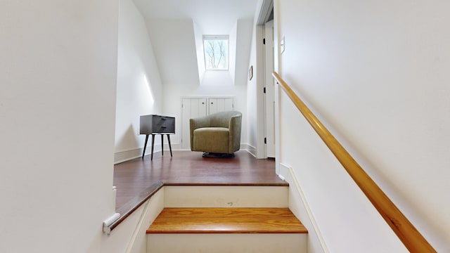 staircase with wood finished floors