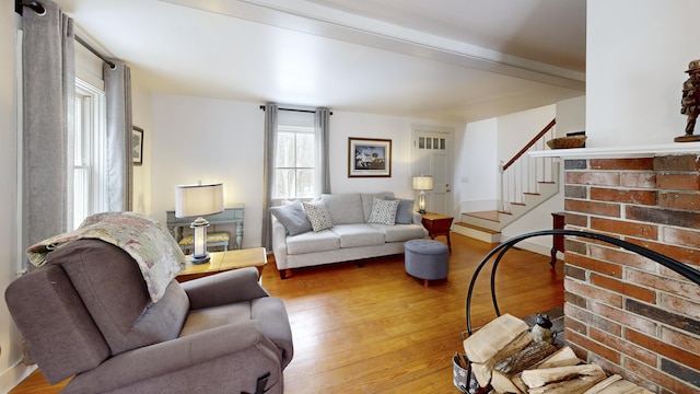 living area featuring stairs and hardwood / wood-style flooring