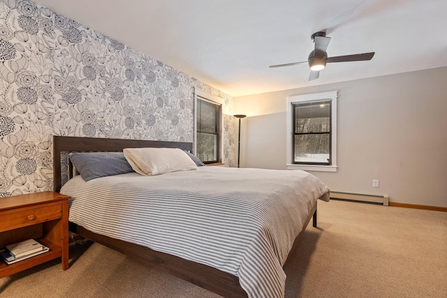 carpeted bedroom with wallpapered walls, baseboards, baseboard heating, and ceiling fan