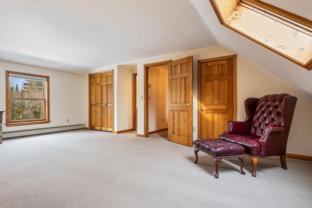 living area featuring baseboard heating, light colored carpet, baseboards, and vaulted ceiling