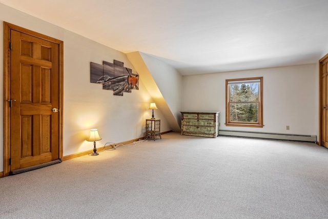 interior space with carpet flooring, baseboards, and a baseboard radiator