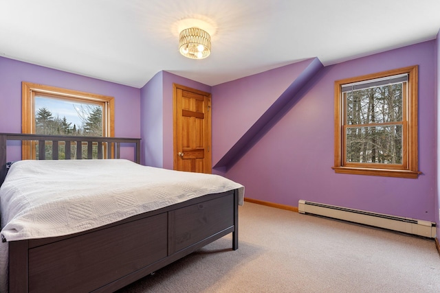 bedroom featuring light colored carpet, baseboards, and a baseboard radiator