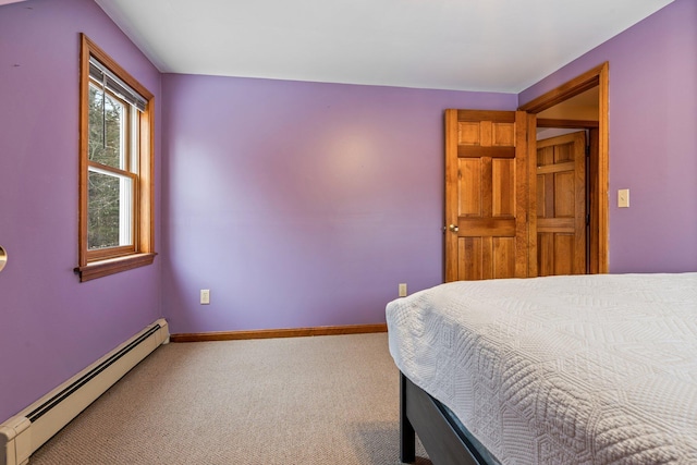 carpeted bedroom featuring a baseboard radiator and baseboards