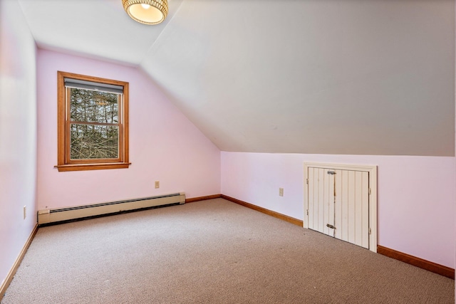 bonus room featuring baseboard heating, baseboards, and carpet