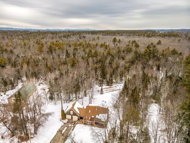 bird's eye view featuring a wooded view