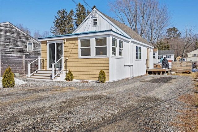 view of front of home with fence and driveway