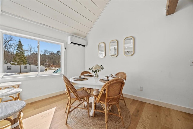 dining room featuring wood finished floors, baseboards, lofted ceiling, wood ceiling, and a wall mounted air conditioner