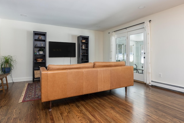 living room with baseboards, baseboard heating, and dark wood finished floors