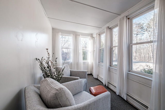 sunroom / solarium featuring baseboard heating