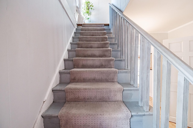 staircase with ornamental molding