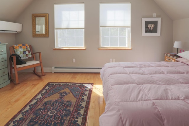bedroom with hardwood / wood-style flooring, lofted ceiling, a wall unit AC, and baseboard heating
