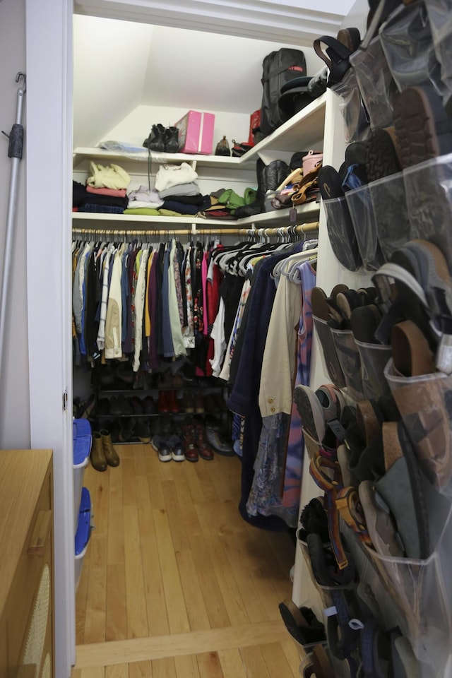 spacious closet with lofted ceiling and wood-type flooring